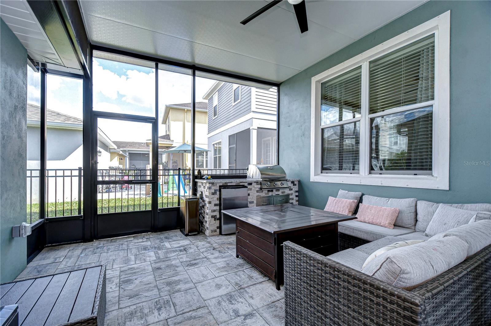 Spacious screened lanai with built-in grill.