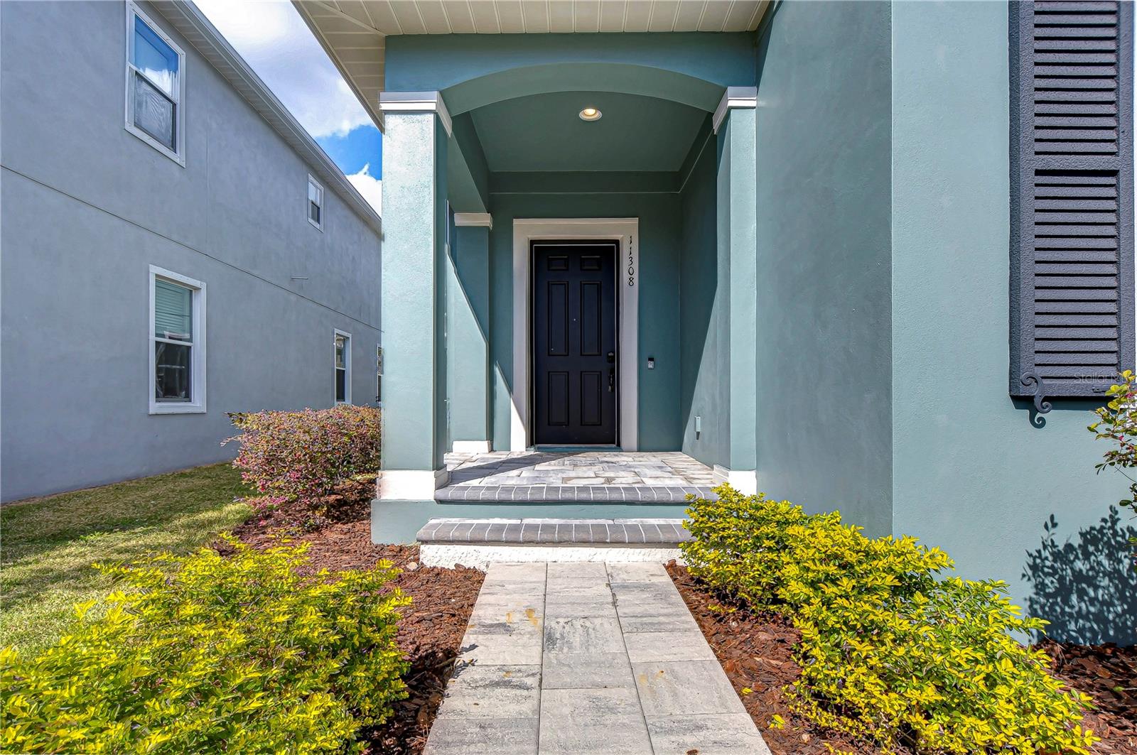 Welcoming front entryway with curb appeal.