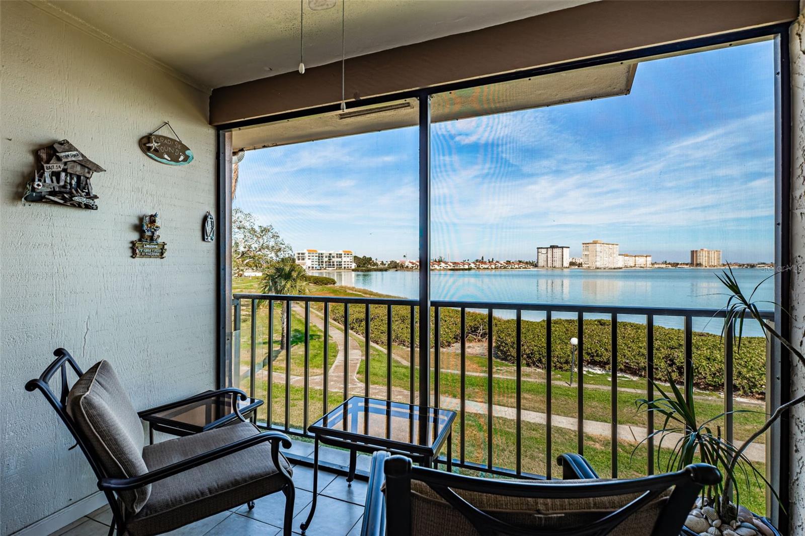 Relax and enjoy the beautiful water view from your screen balcony