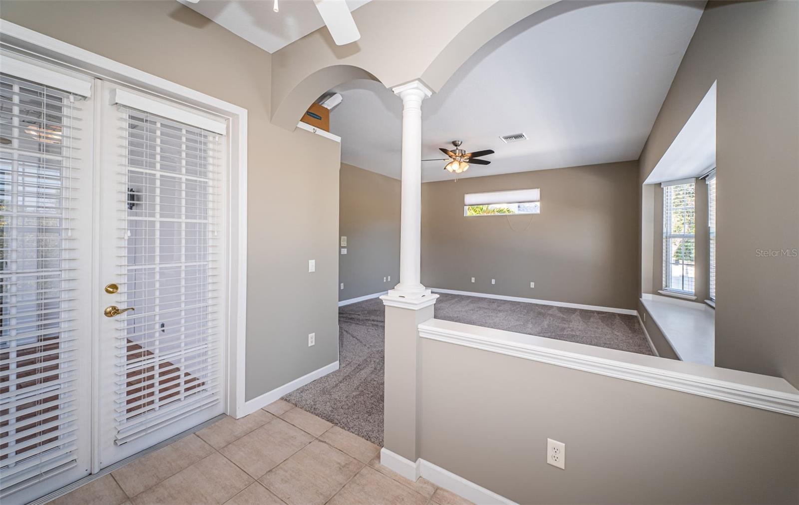 Separate french doors from primary bedroom to pool deck.