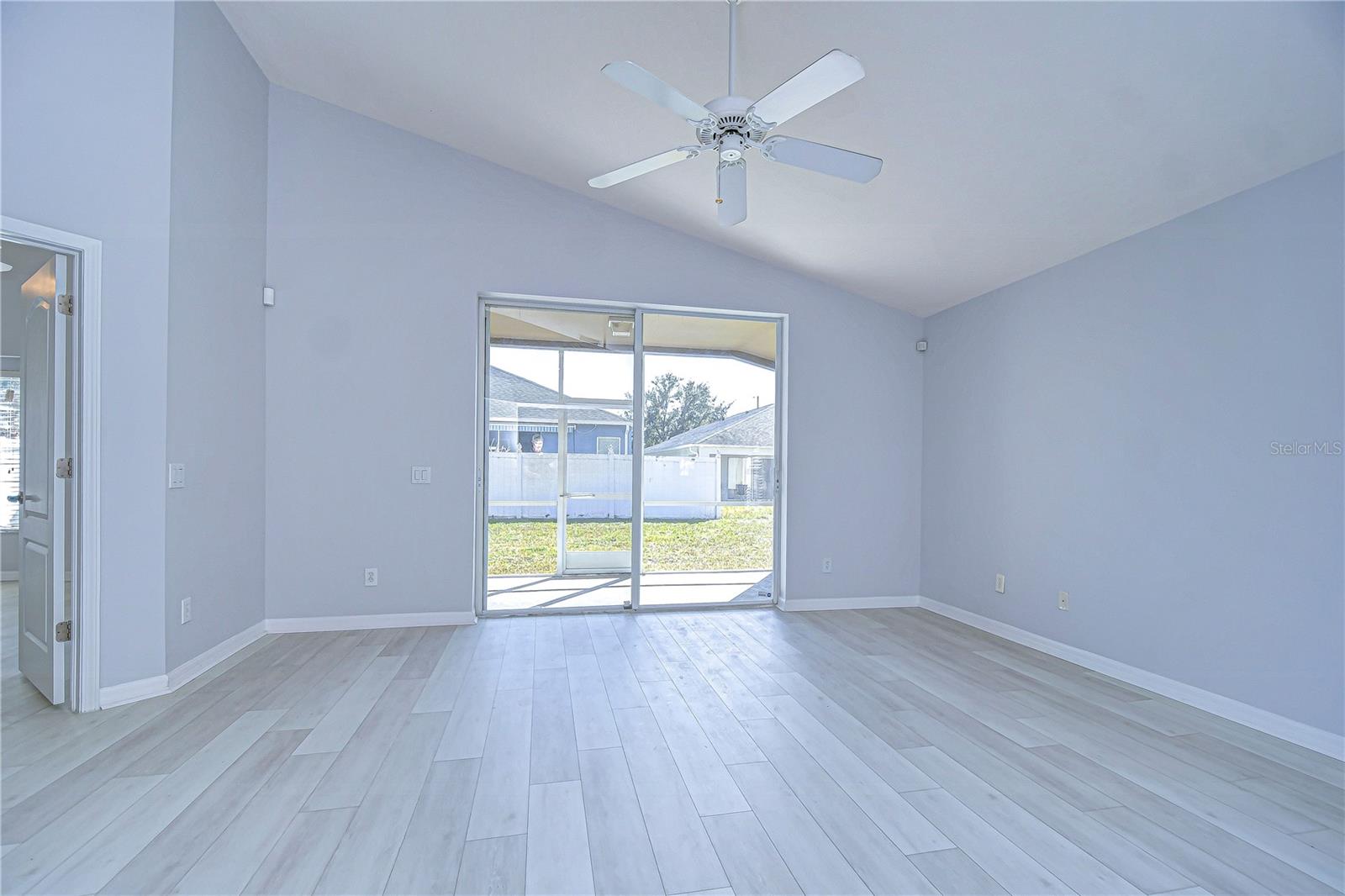 Family Room Opens to Screened Lanai and Backyard