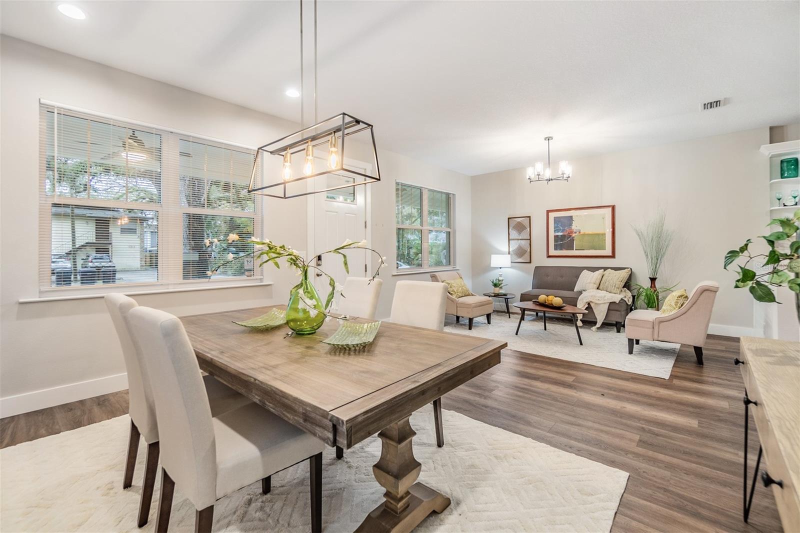 Formal Dining and Living Room Area, inset lights, new lighting fixtures, Laminate Flooring, Blinds and lots of sunlight.