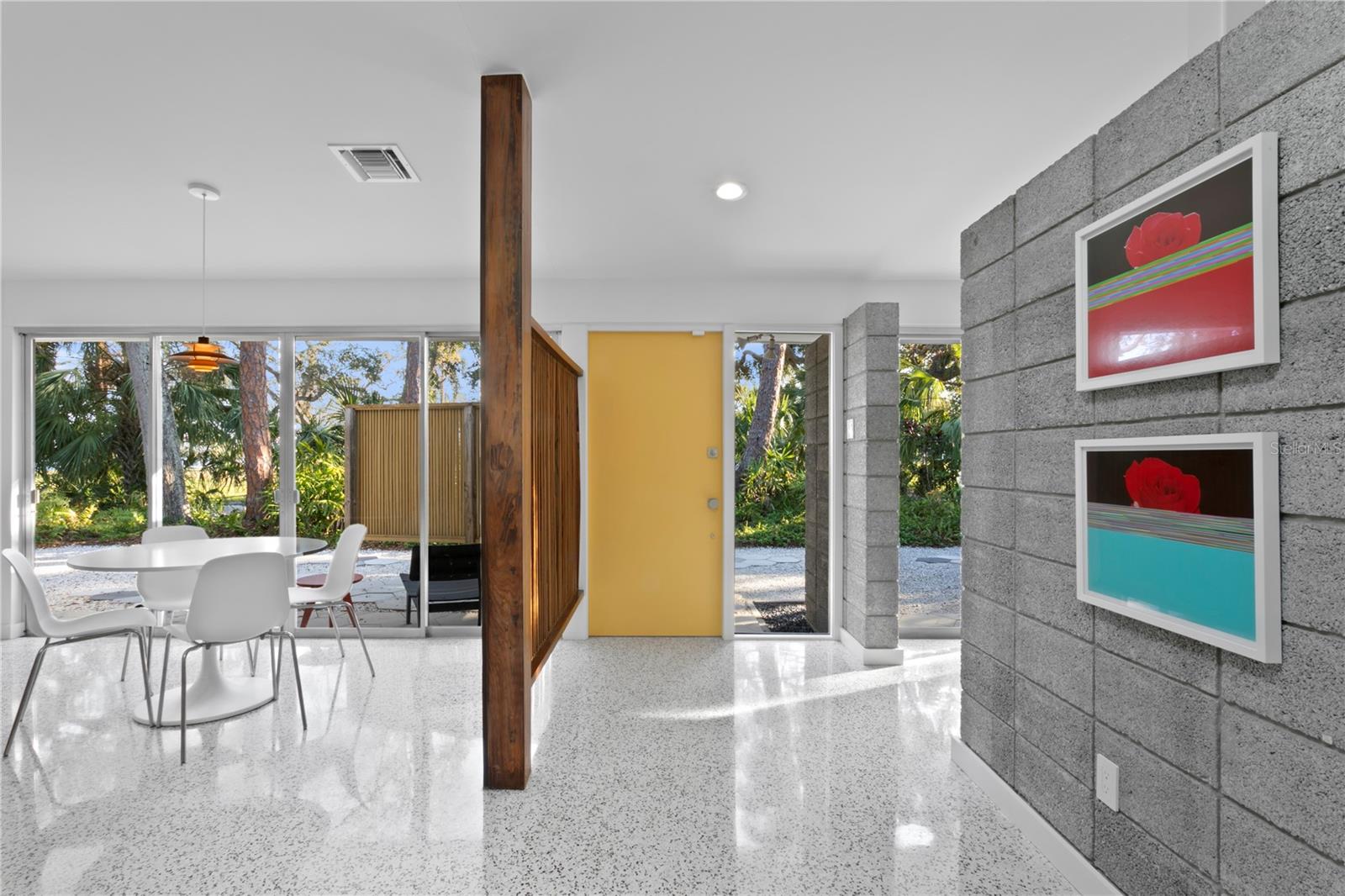 Original floor-to-ceiling windows in the second family room or study.