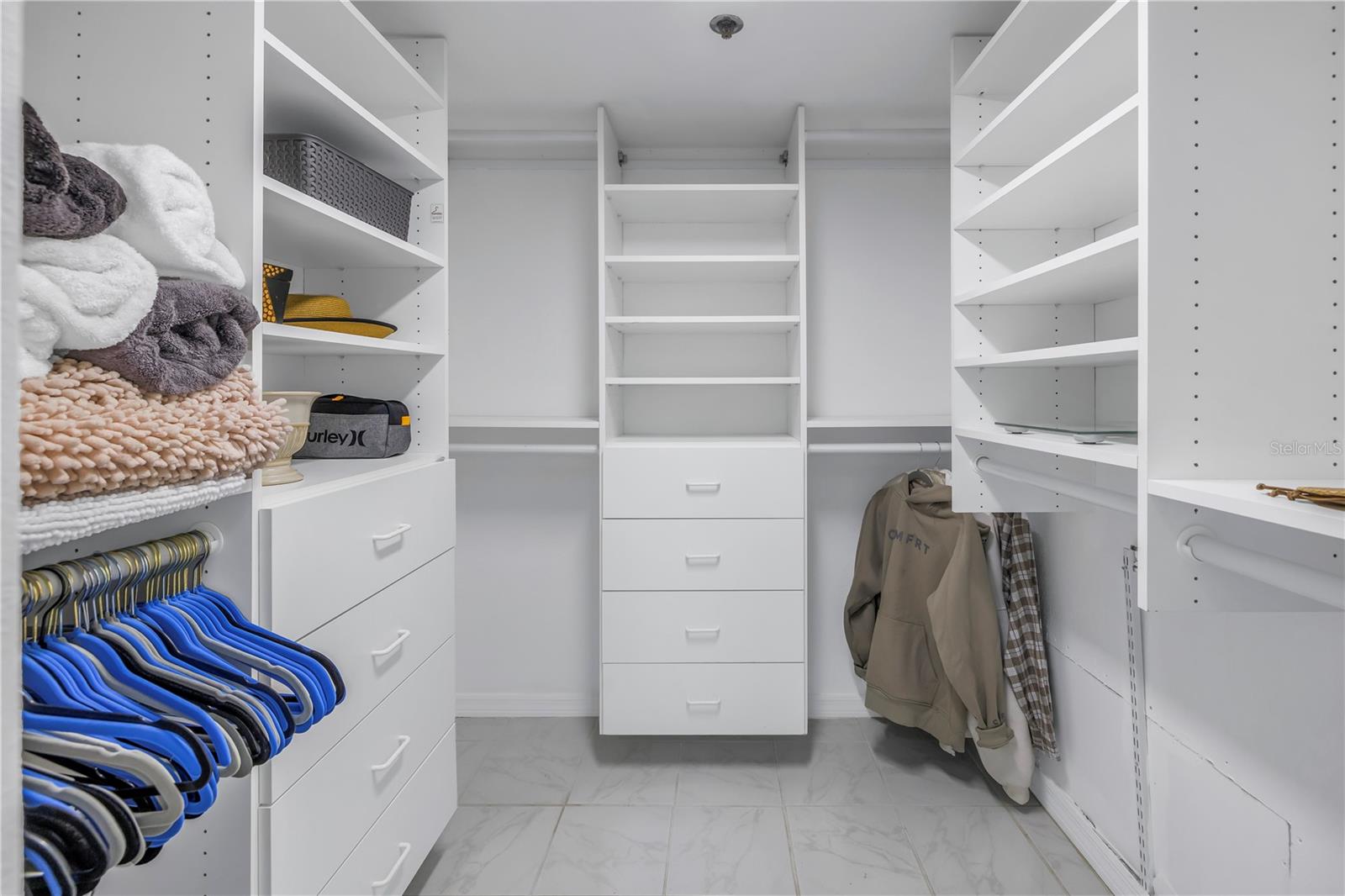 Primary bedroom walk in  closet.