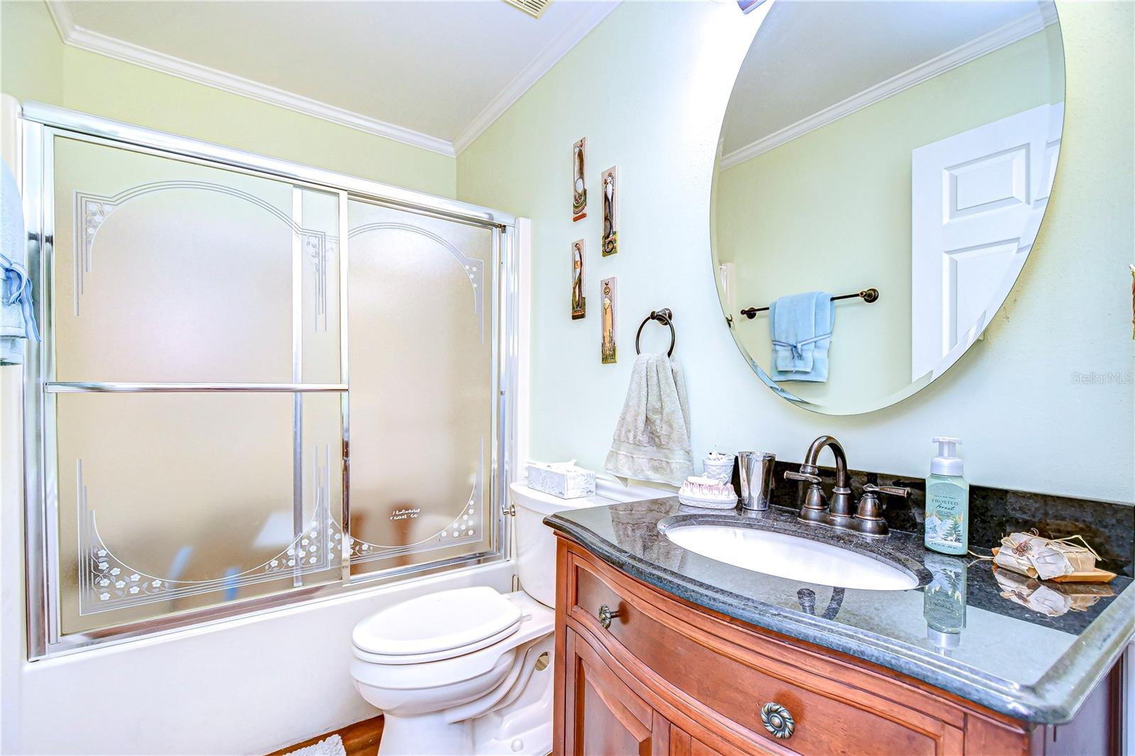 Second bathroom with tub and shower combo.