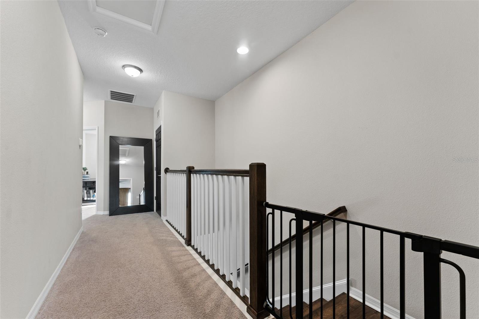 Spacious Hallway with Lots of Elbow Room Providing Split Floor Plan