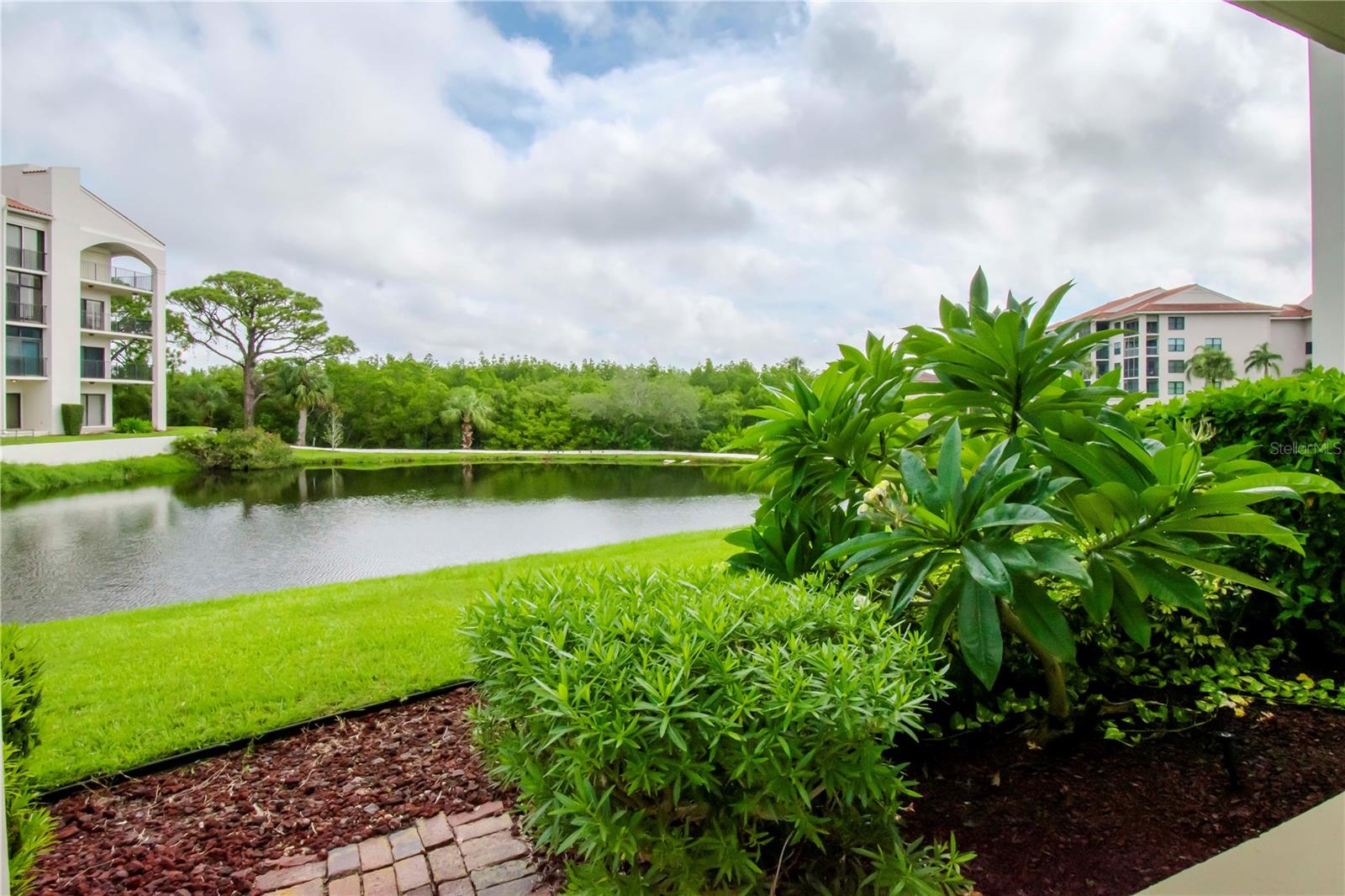 Patio past corner overlooking pond