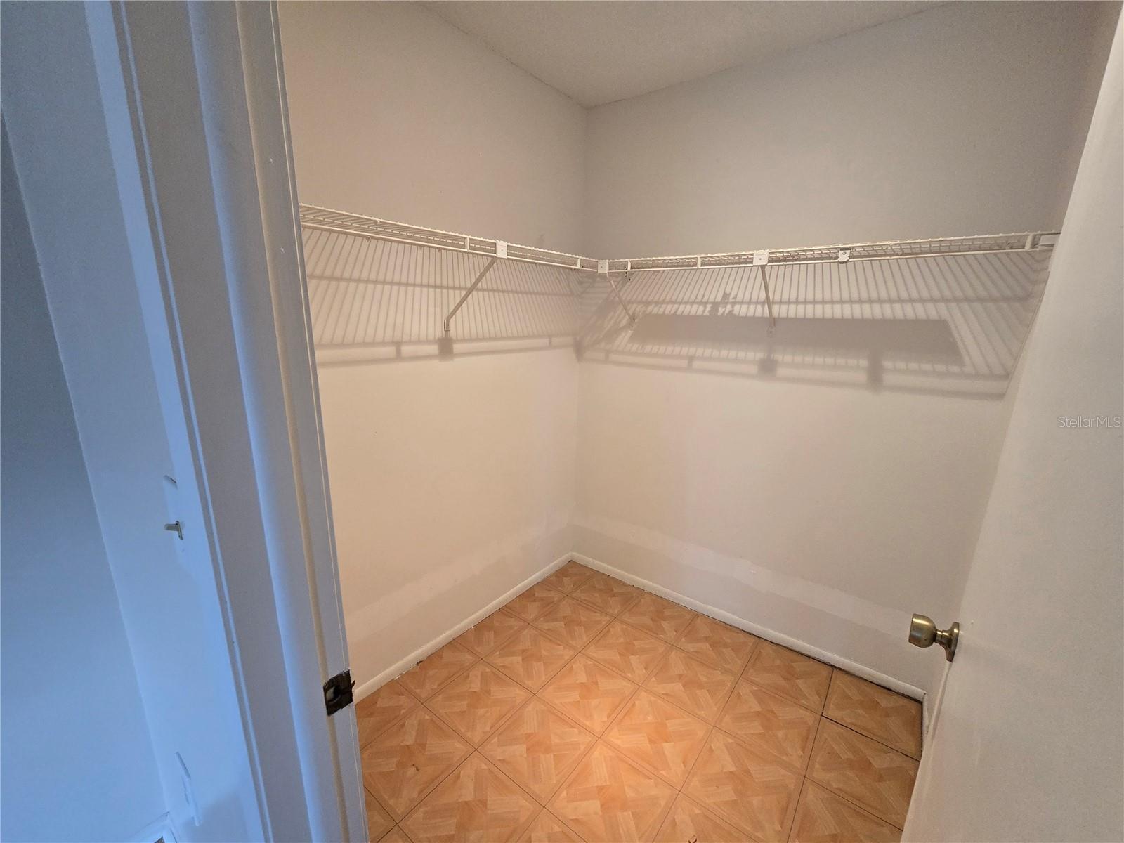 Primary bedroom closet is a walk-in