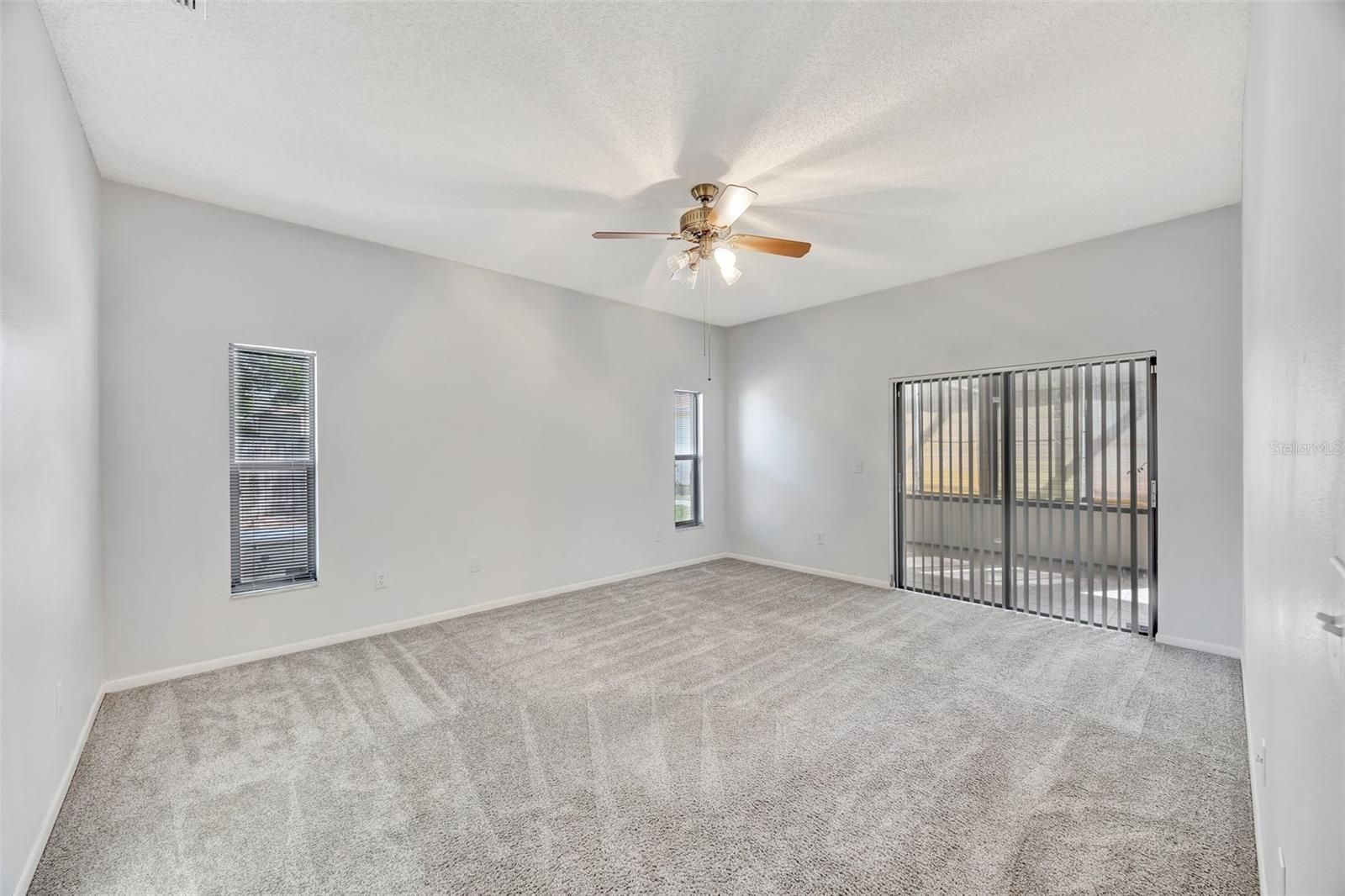 The primary bedroom is large and has Sliders leading out the enclosed florida room.