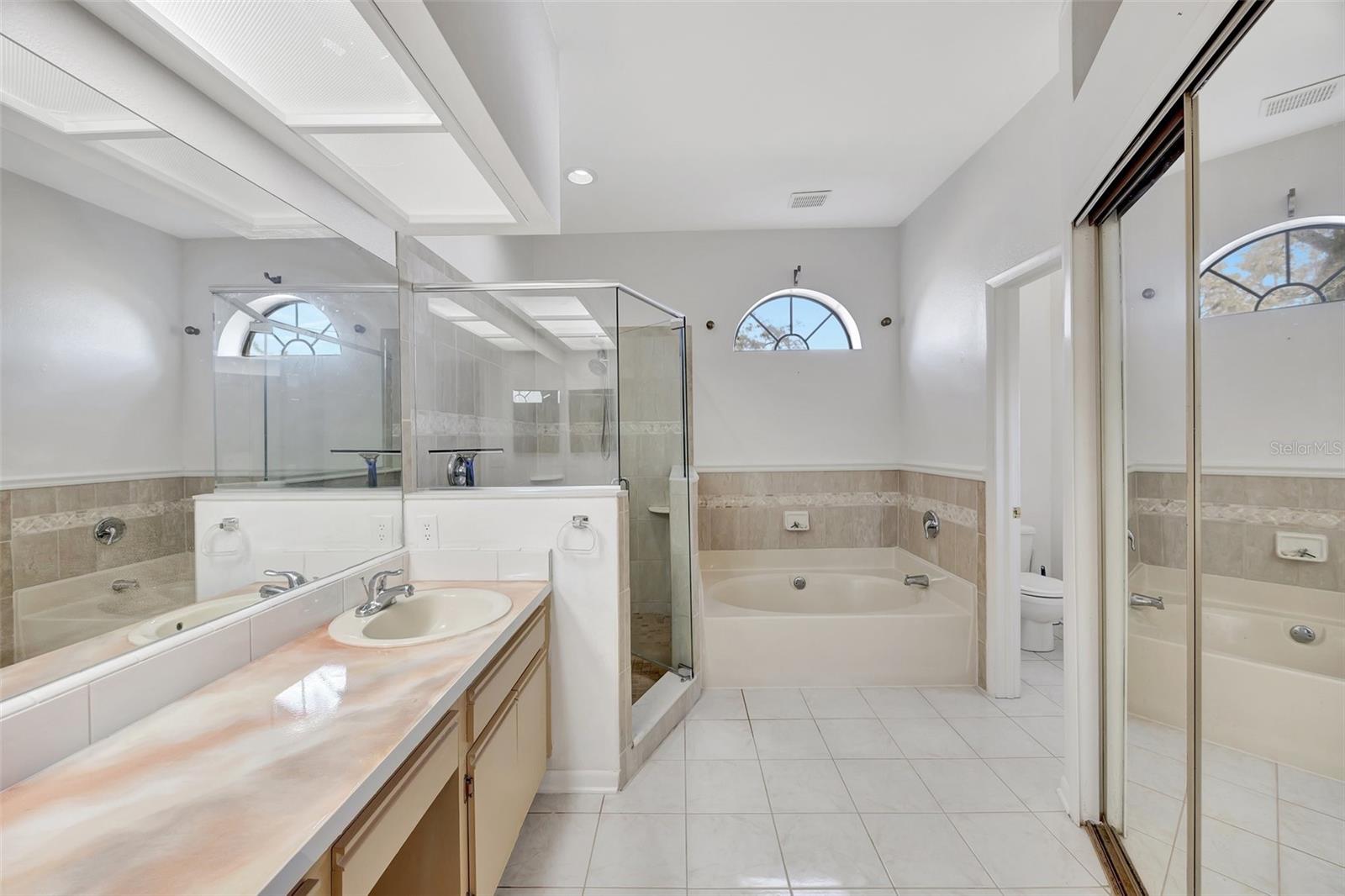 En-suite bath to Primary Bedroom, with shower, soaking tub, walk-in closet and water Closet.