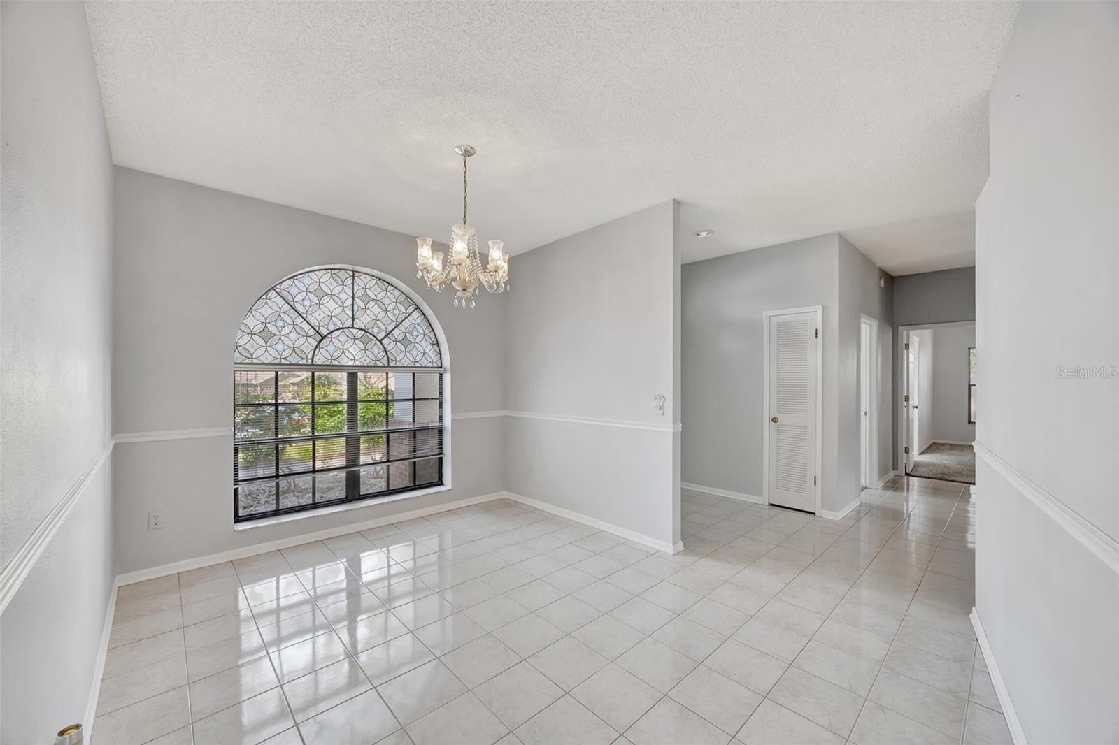 To the right of the entrance foyer you have a formal dining area that is spacious and bright.