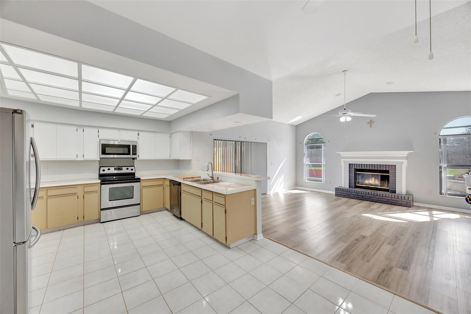 The kitchen has a breakfast bar where you can put stools and leads into thee family room with a fireplace and sliders out to the florida room.