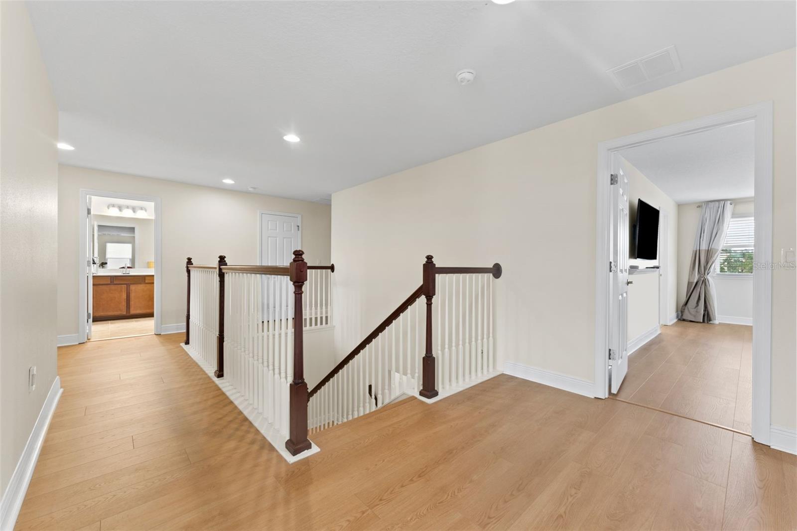 Gorgeous Bamboo Staircase With Convenient Midpoint Landing That Matches the 1st Floor Flooring