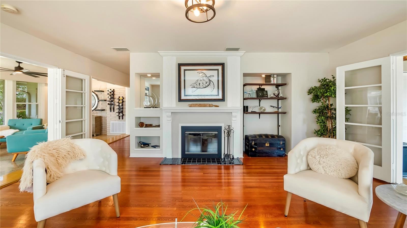 Bright and airy living room with plenty ofnatural light and comfortable seating