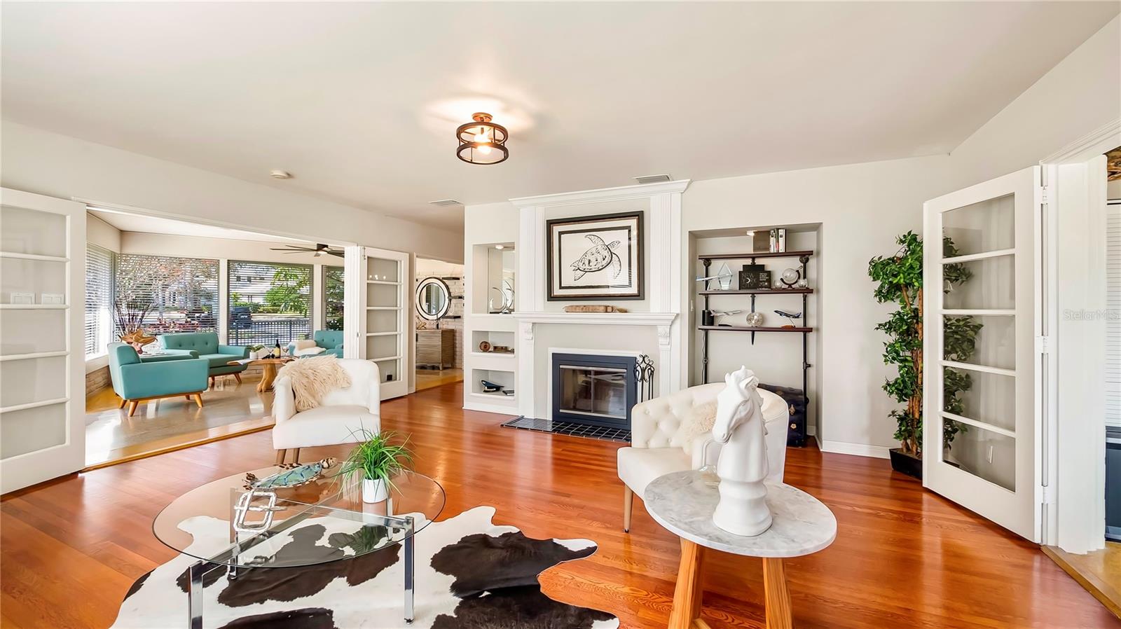 Stylish living room with a modern fireplace and built-in shelving.