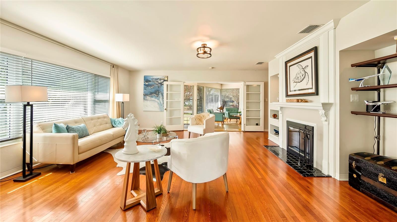 Stylish living room with a modern fireplace and built-in shelving.