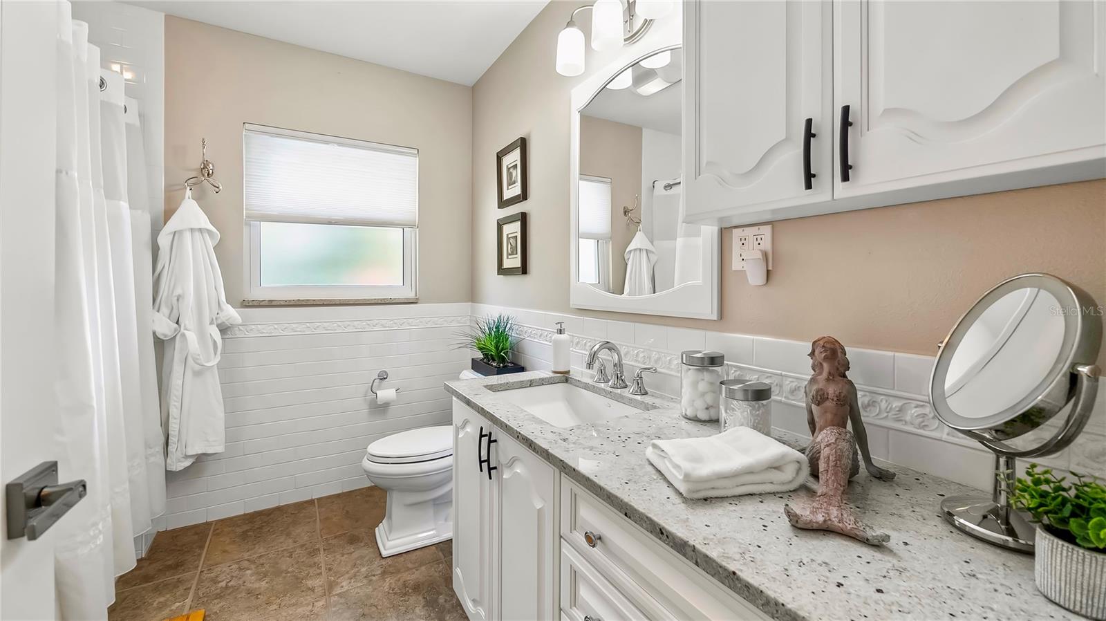 Stylish bathroom with a  vanity and plenty of counter space