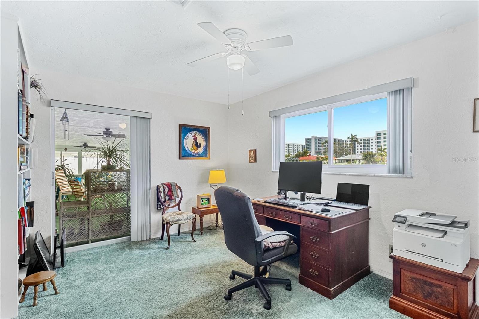 This third bedroom opens to the Florida room and overlooks the water.