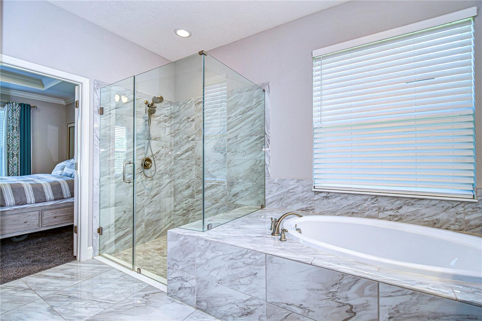 HUGE walk in shower and soaking tub highlight the en-suite bath!