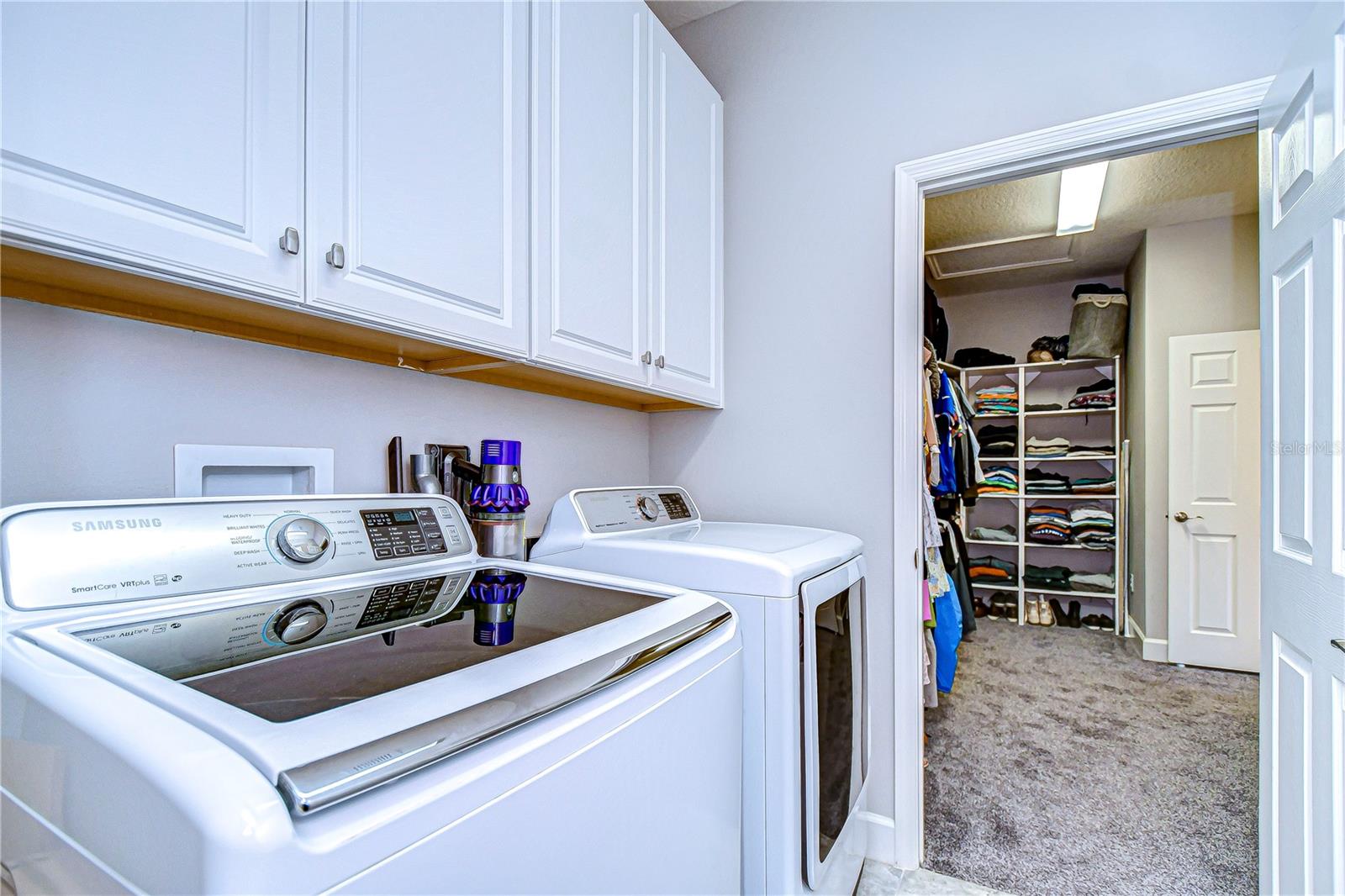 Laundry room connected to primary closet!