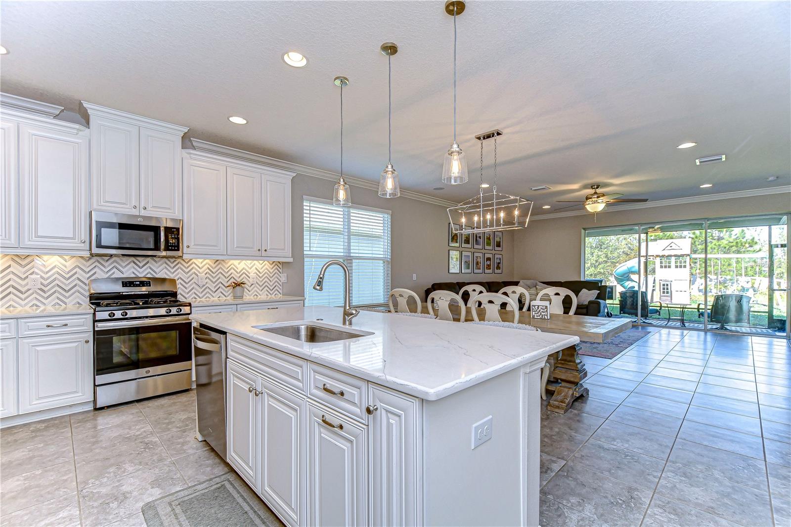 Stainless steel appliances, crown molding and thoughtfully crafted cabinets make this kitchen the epitome of luxury.