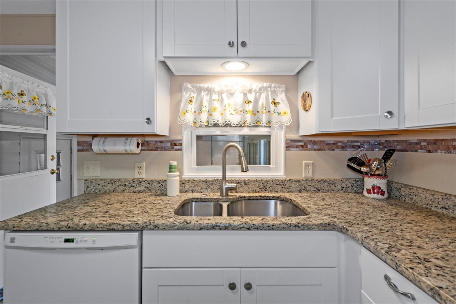 There are 2 deep under mount sinks in this beautiful kitchen