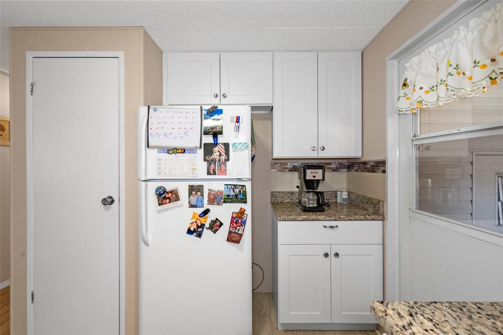 The refrigerator is newer and there is a second pantry