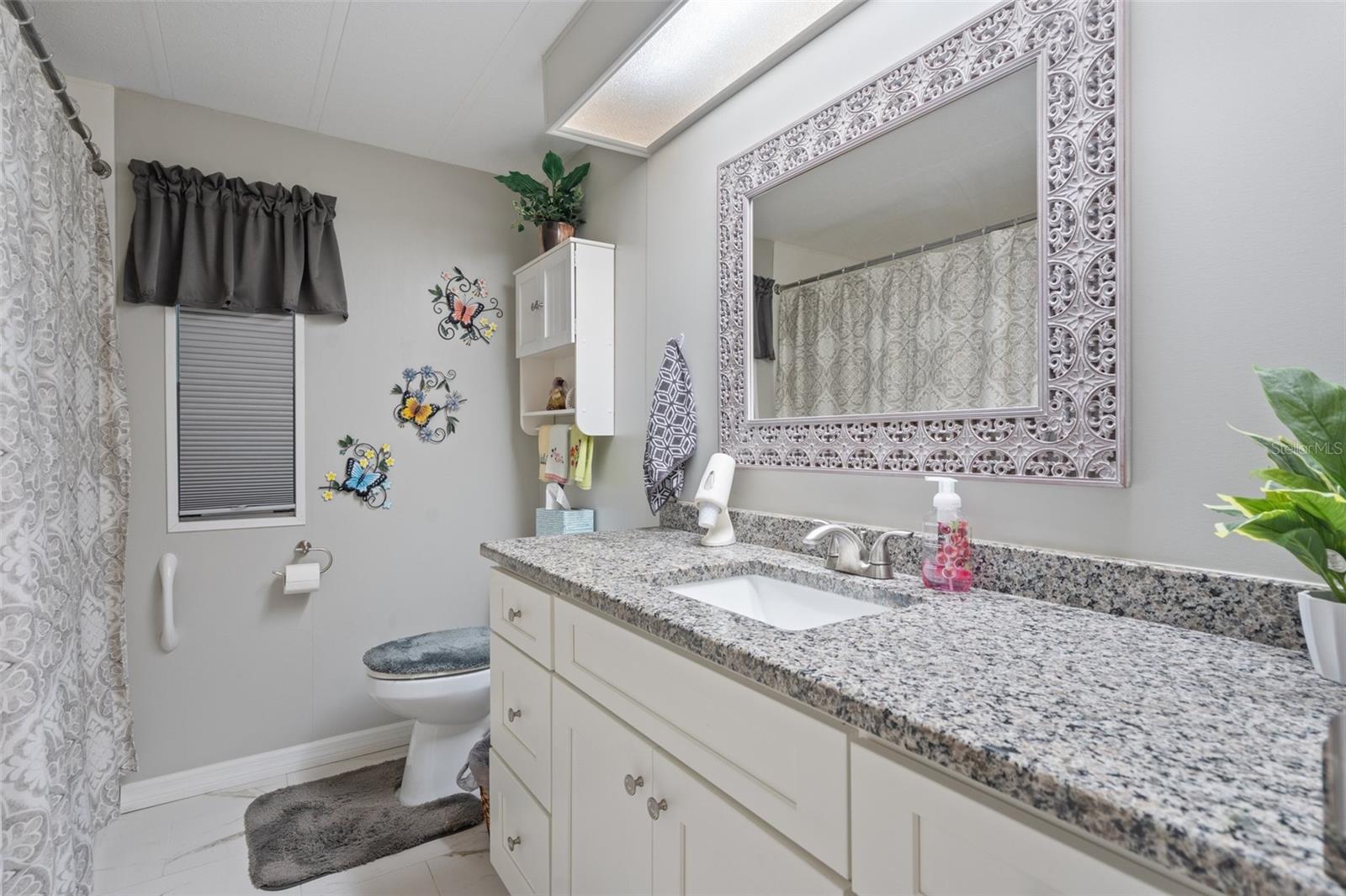 Guest Bathroom has a gorgeous vanity with granite top