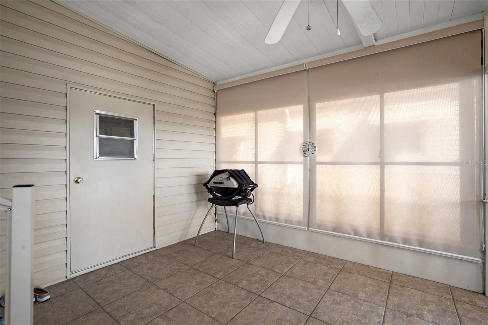 Notice the beautiful tiles in the screened in porch