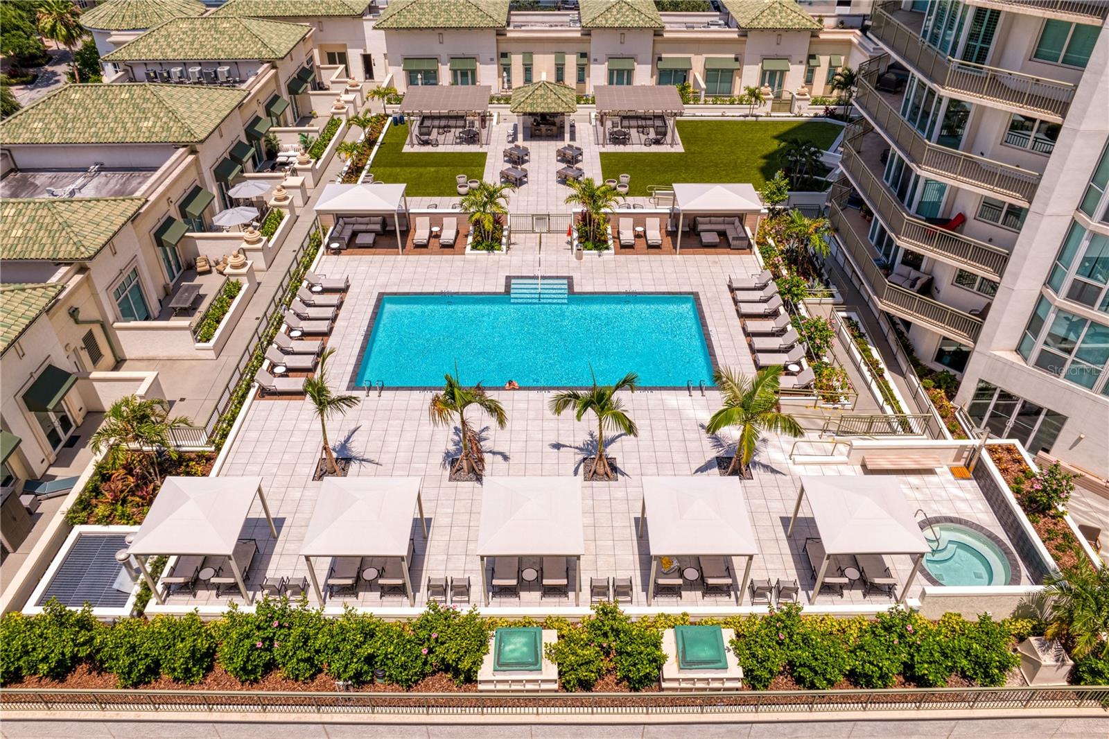 The Palm Court amenity level which features resort style heated infinity pool with hot tub, and pool-side cabanas.