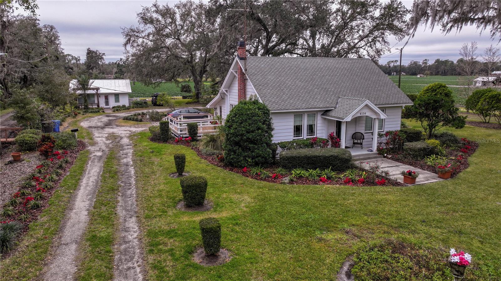 Front -side overview and Driveway to Studio