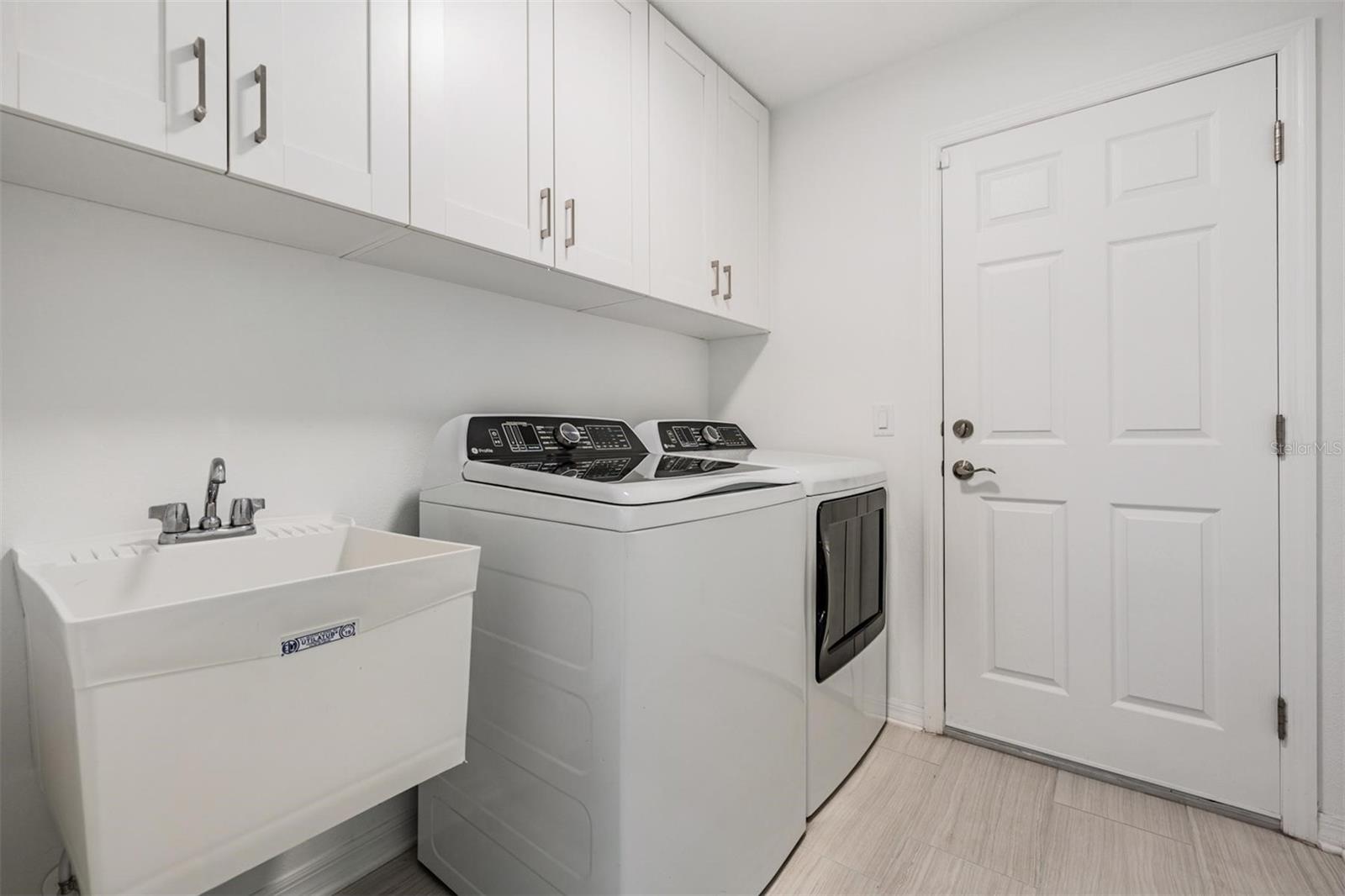 laundry room with sink & cabinets