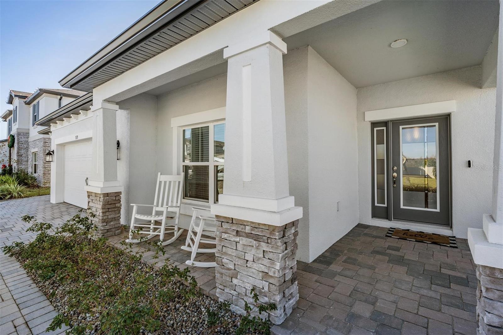 Covered porch w/pavers and plenty of room for seating!