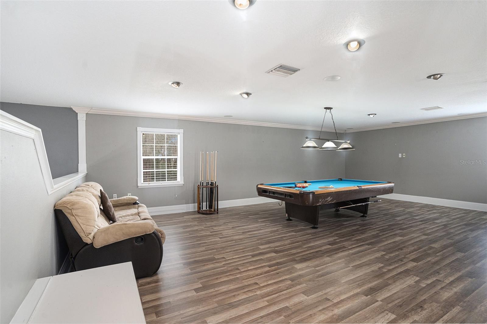 Bonus Room.  Pool table and 2 couches convey