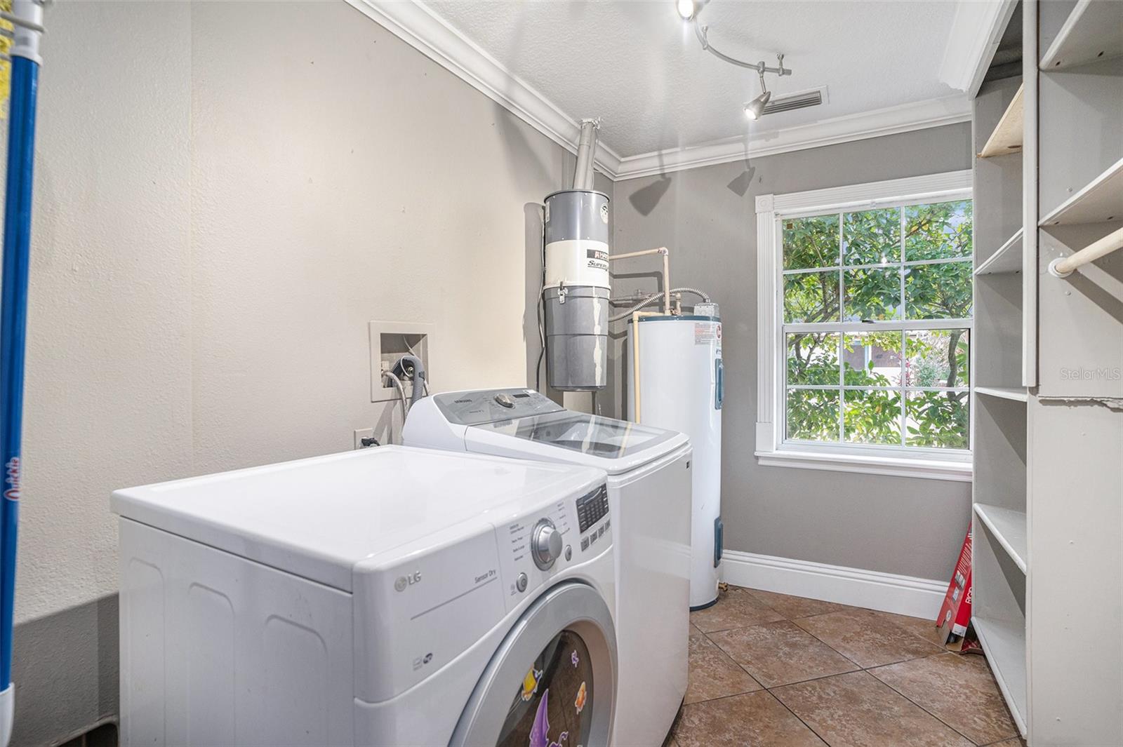 Laundry room with lots of storage and the central vacuum system