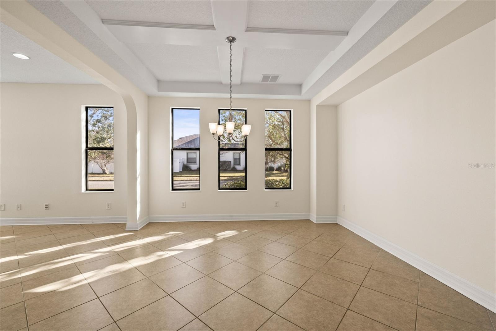 Dining room with cross-tray ceiling.