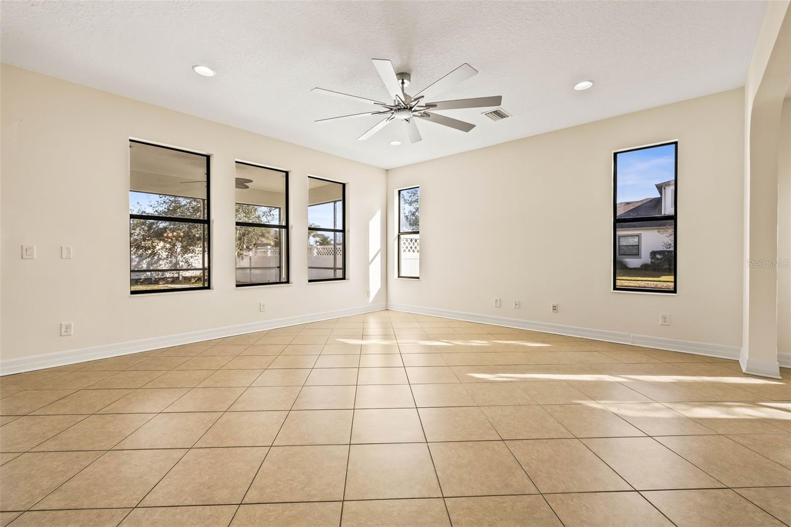 Living room with tile flooring laid on the bias.