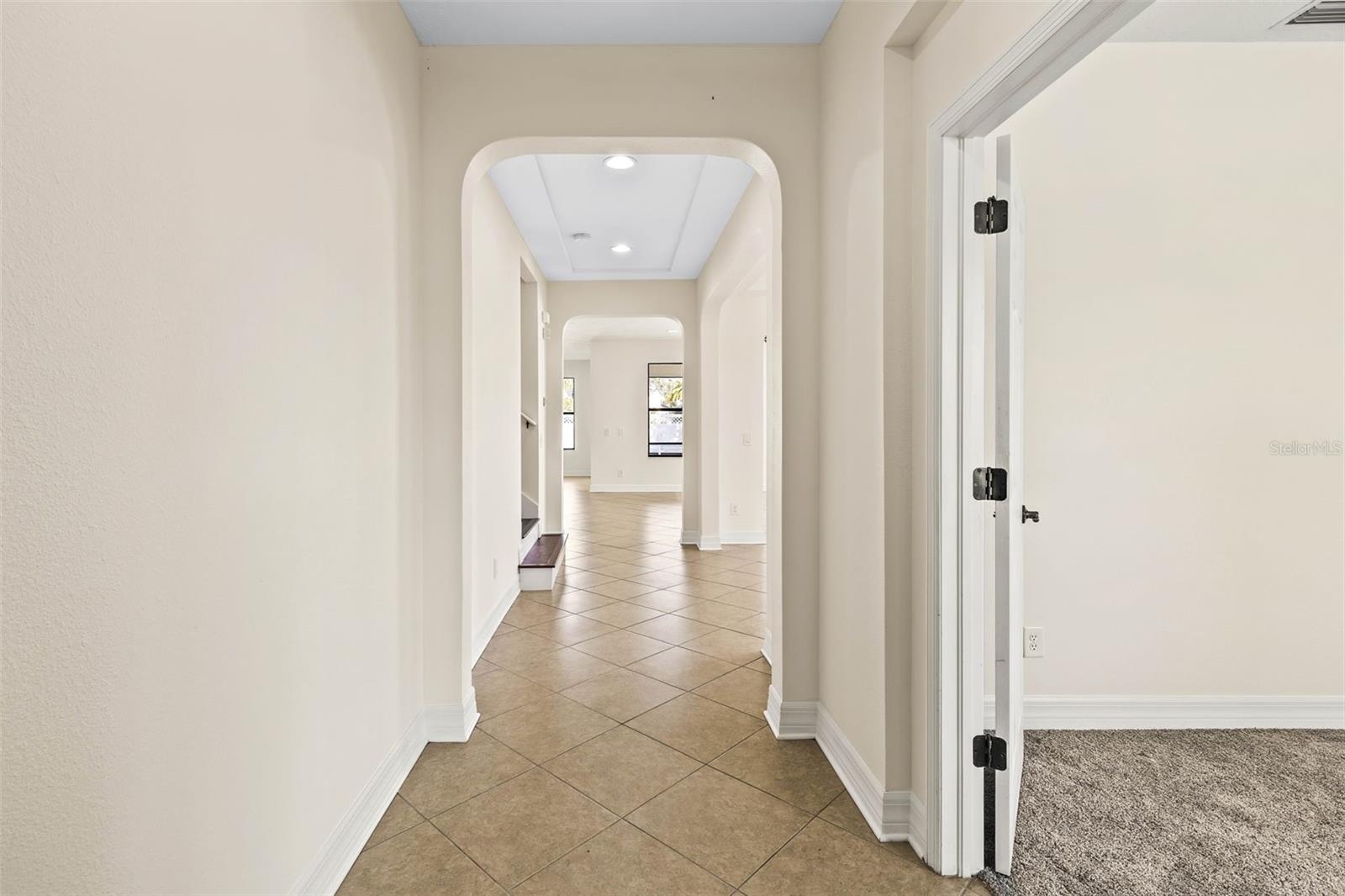 Enter into your new home with rounded archways, tray ceilings, and upgrades throughout.