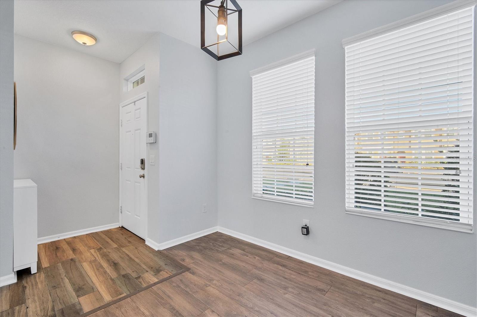 Front entry/foyer and dining room have natural light through 2 windows.