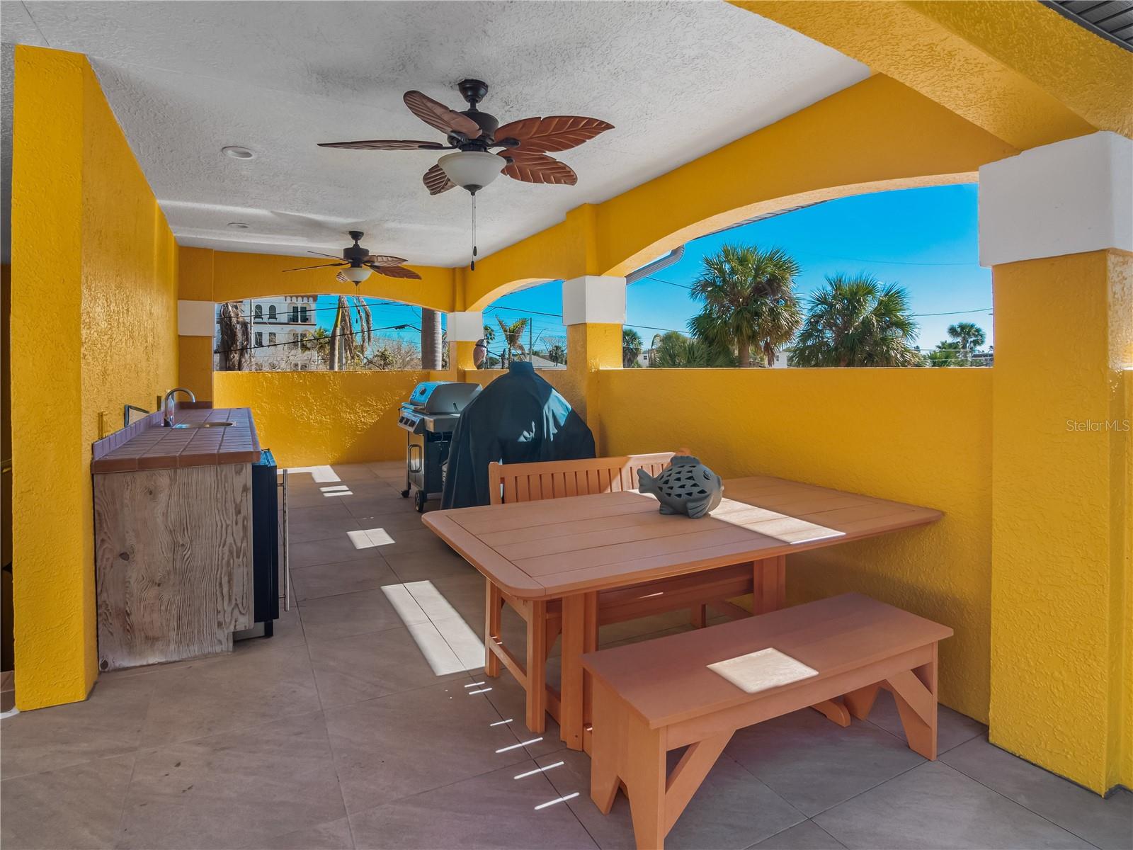 South of the street side stairwell Kitchen BBQ area.