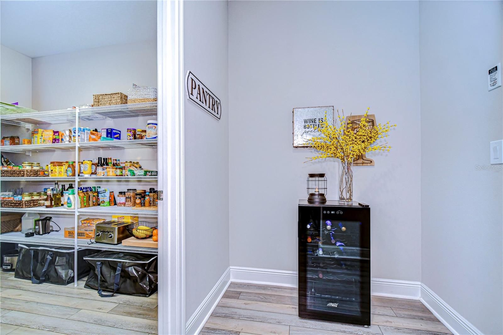 MASSIVE walk in pantry offers so much space to store food, appliances, and more!