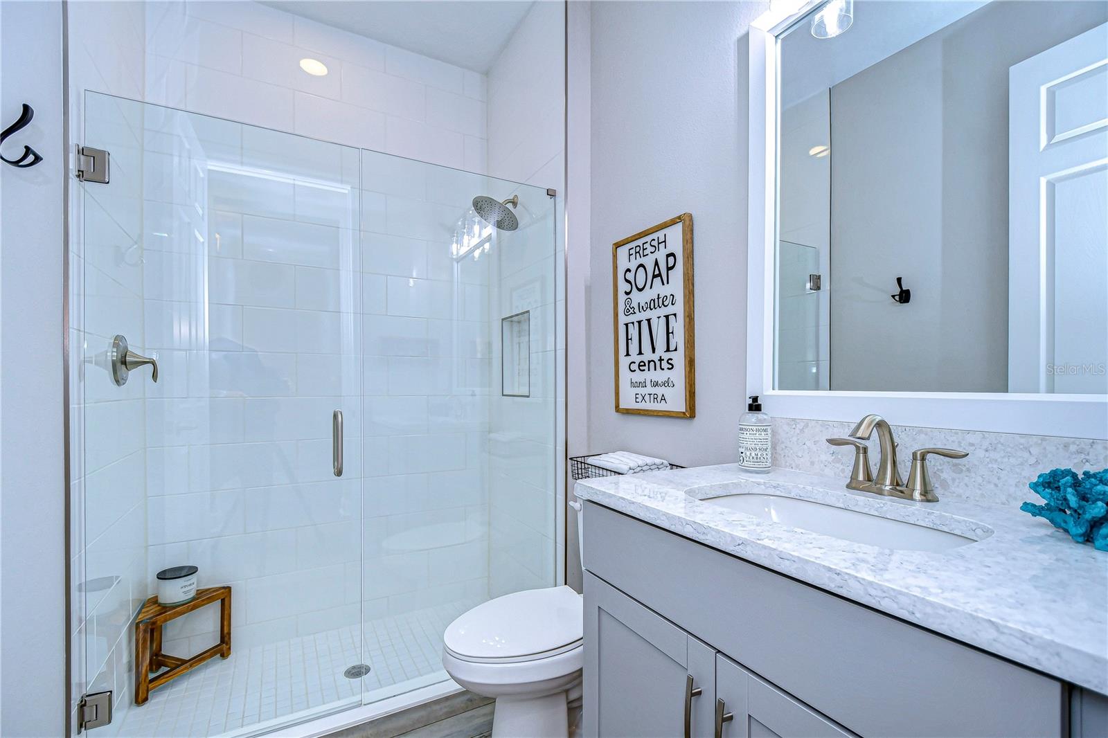 Downstairs bathroom stuns with a large walk in shower and gorgeous countertops!