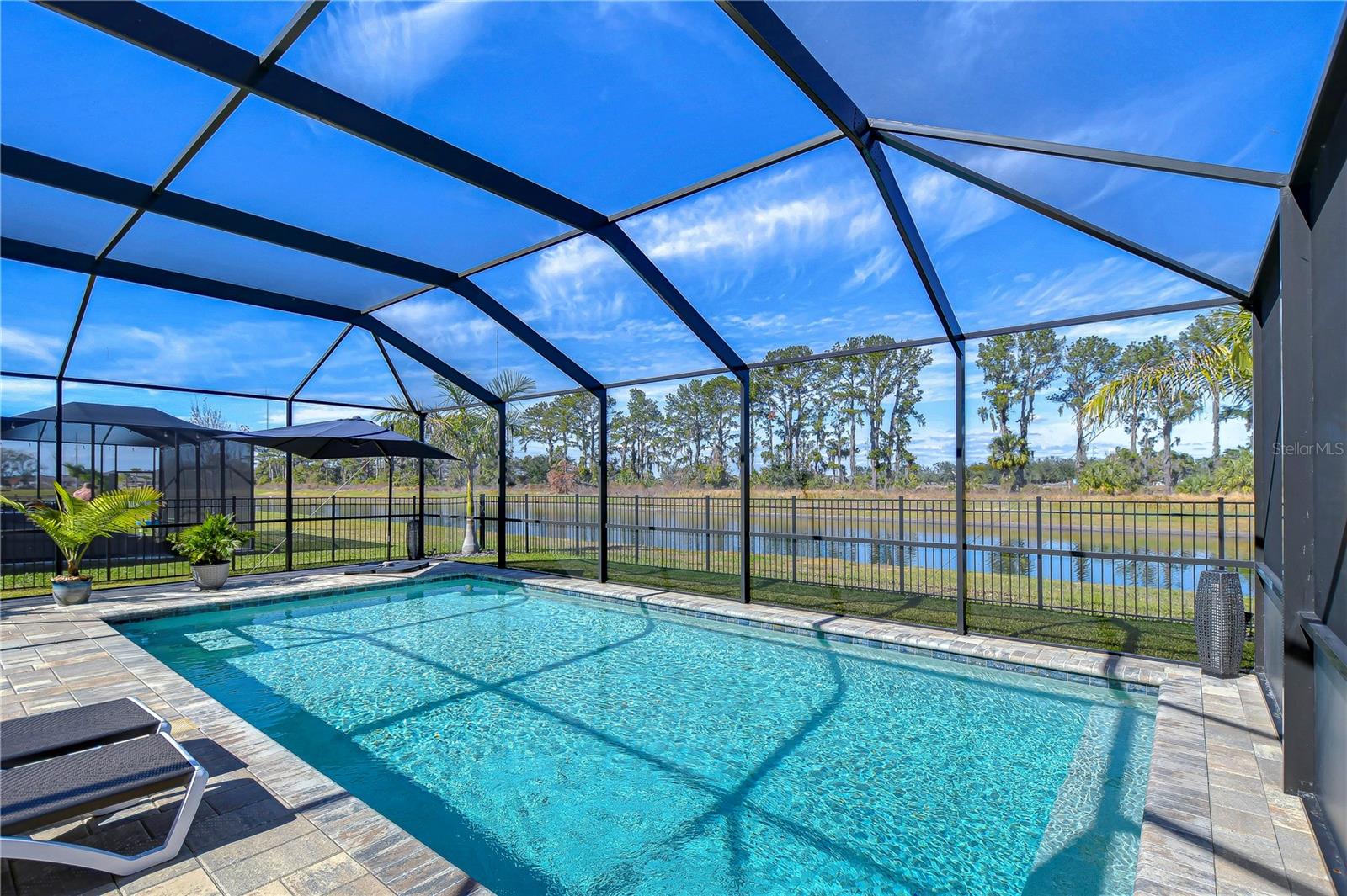 Stunning water and nature views make this outdoor space tranquil.