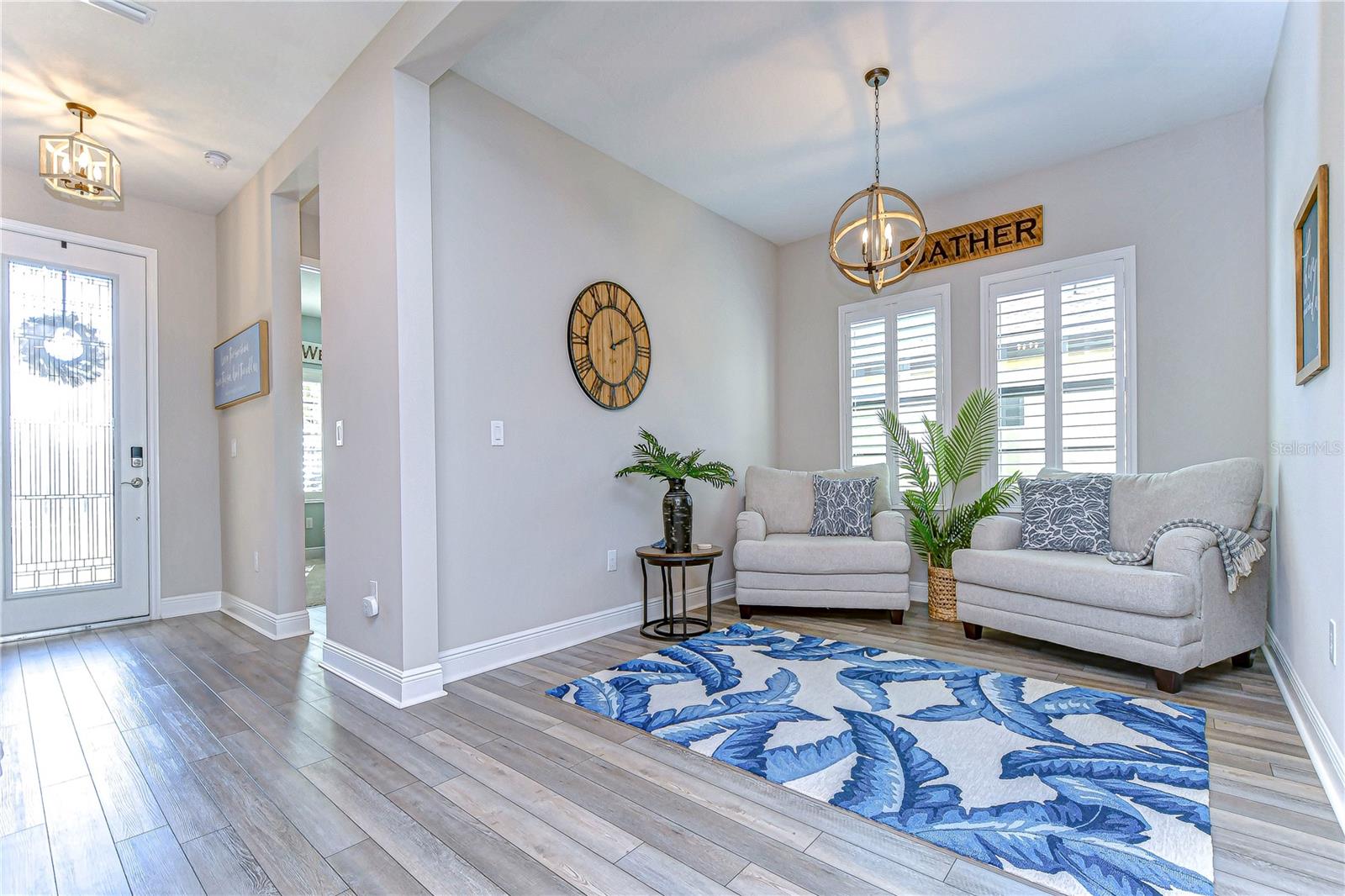 Enter through the jaw dropping foyer that is FULL of natural light.