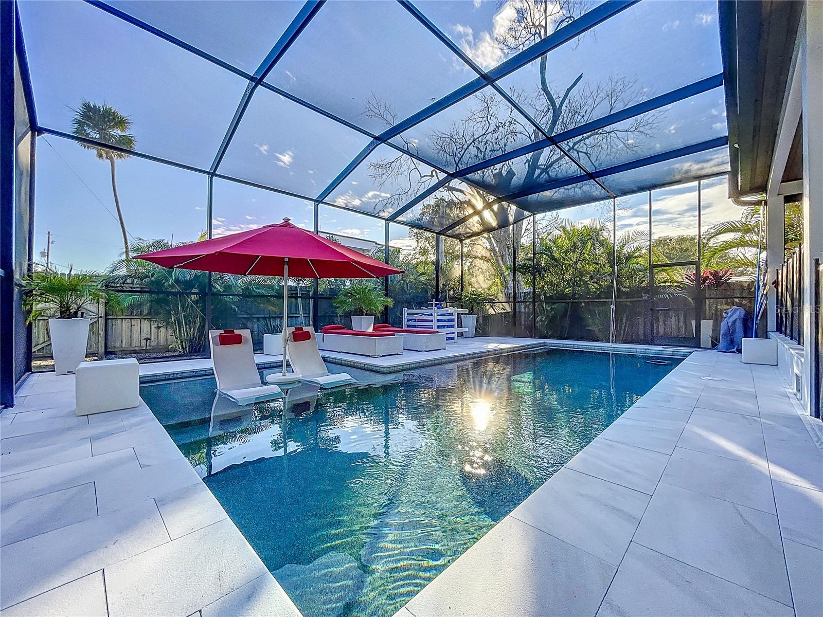 Brand new pool, sunshelf, marble patio, and lanai cage. Pool can be heated with the solar panels.