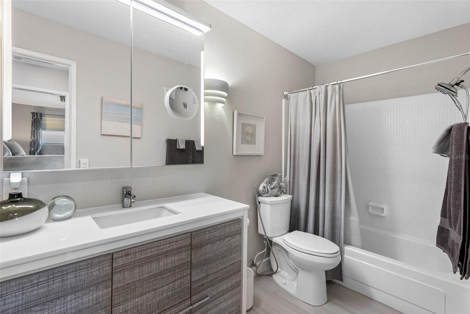 Updated Bathroom: Spa-like vanity and modern fixtures for a luxurious touch.