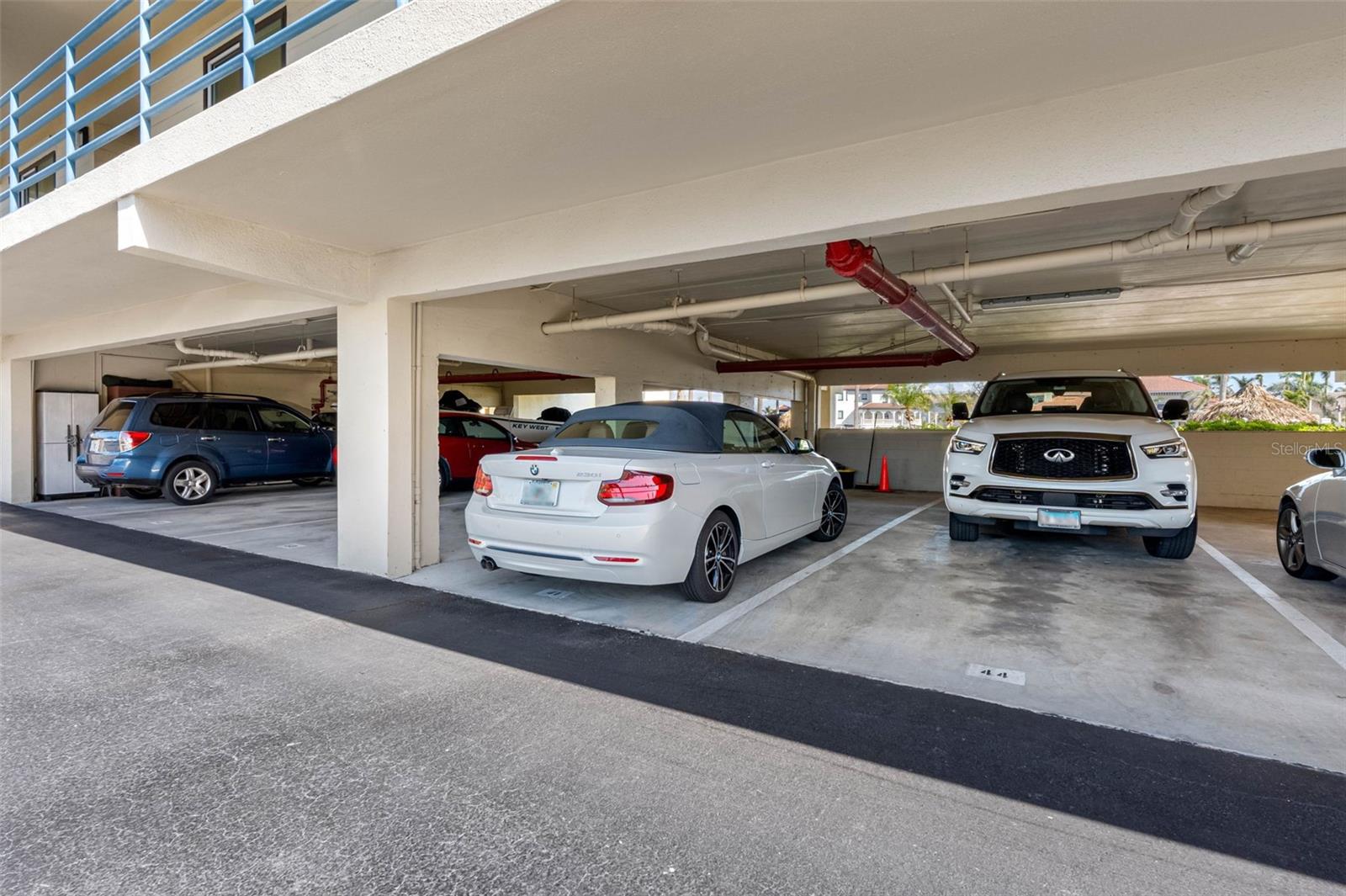 Under cover Tanden parking spot for two cars.