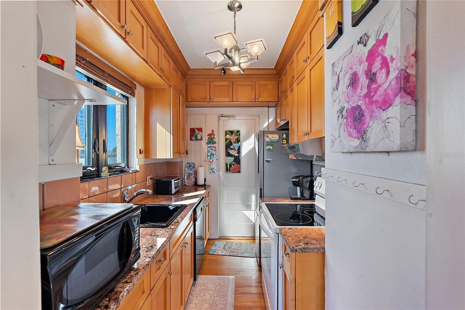 Kitchen with dishwasher and city views over the kitchen sink