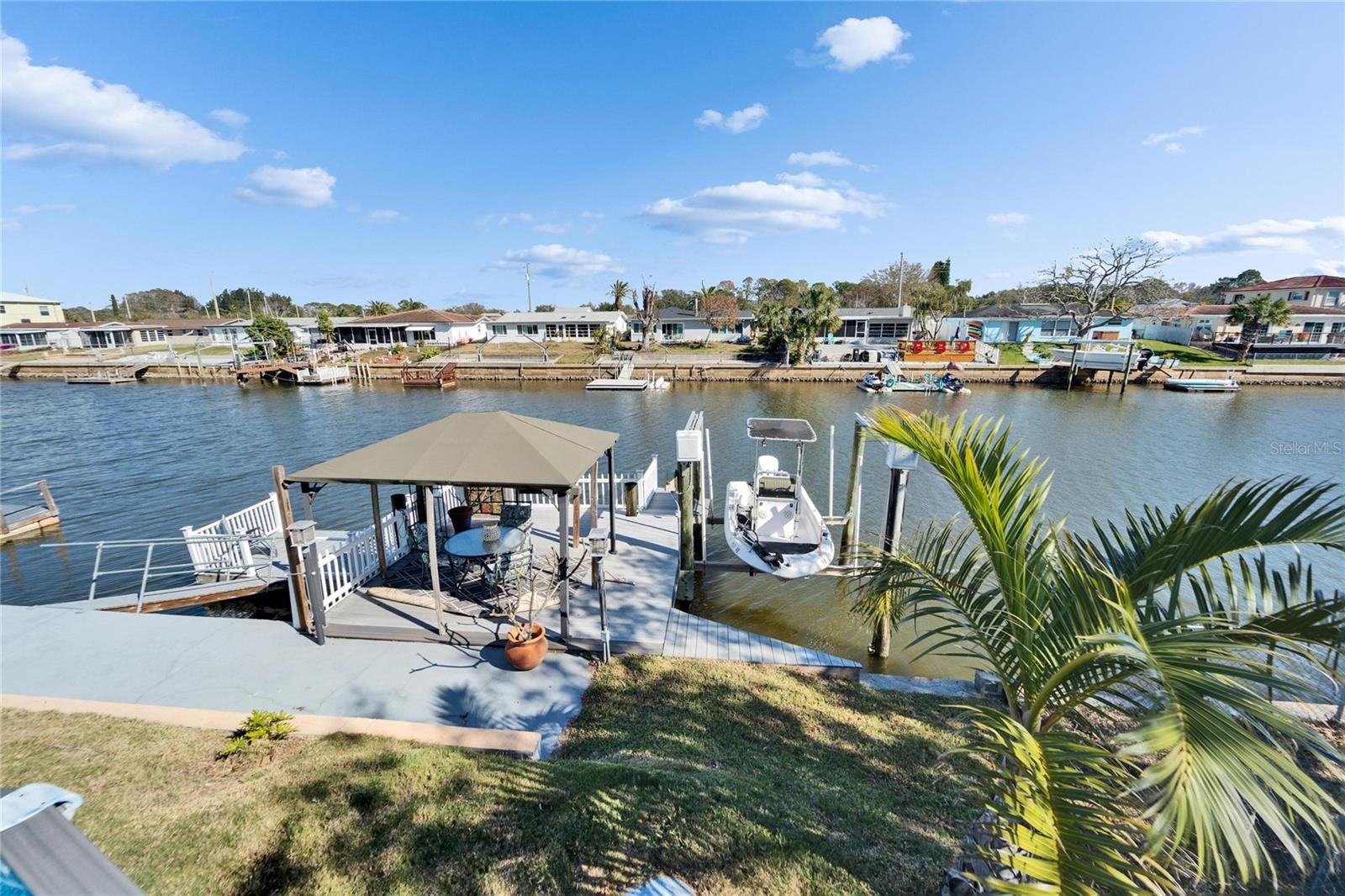 Backyard View of Boat Dock and Deck