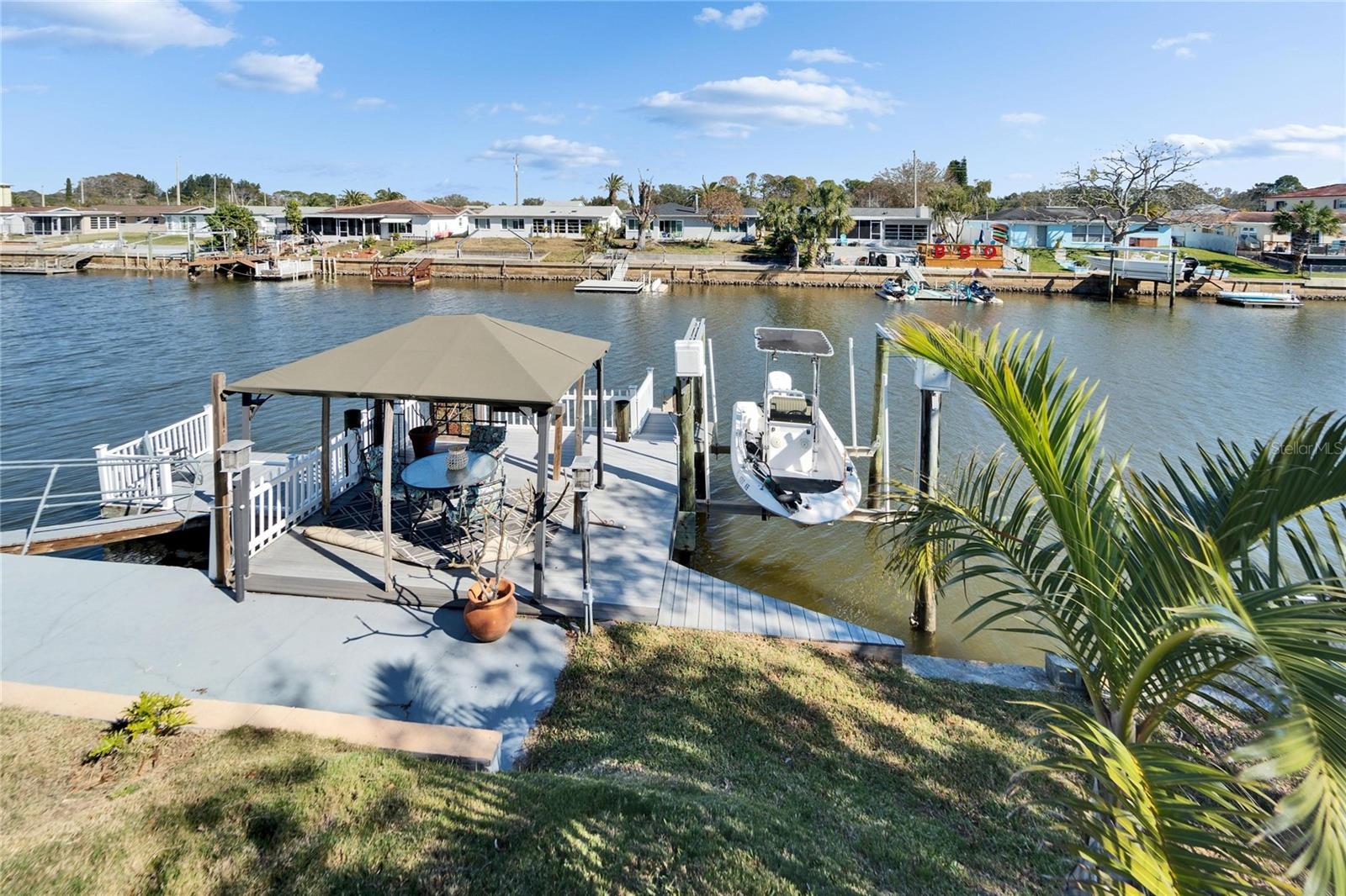 Backyard View of Boat Dock and Deck